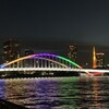 五輪カラーに染まる隅田川に架かる橋②：永代橋（再登場）、佃大橋、勝鬨橋、築地大橋、清洲橋（再登場）・・・橋とツリーとタワーとの共演