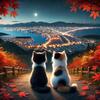 紅葉に包まれた夜、街の灯りを見つめる二匹