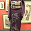 赤紫地モダン植物柄色留袖×黒茶色地異国の城織袋帯