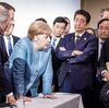 Ｇ７サミットで腕組みをした安倍首相