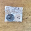 何のボタンかわからない予備のボタンを捨てる。