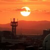 十六夜の月と夕日と