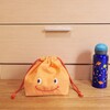 ＜minne＞シャーベットオレンジ×お花　スマイル　お弁当入れ巾着　女の子　出品