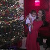 Corrie's Helen Flanagan giggles as she struggles to hold daughter Matilda, 2, while attempting to get a memorable festive photo