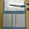 自作のメモ帳に厚紙を付けて、手で持って書きやすいようにする