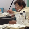 熱心に