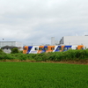 夏草に覆われ走る関東鉄道ディーゼルカー