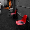 Old red chair in the street corner