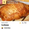 レチョナ／レチョーナ（南米の肉料理22）　「tasteatlas AWARD 24/25 100 Best Dishes in the World」では，「世界１」と評価された逸品！  評価点は4.78！（⇔通常のランキングでは，評価点は4.4） 玉ねぎ，エンドウ豆，ハーブ，種々のスパイスを詰めた豚の丸焼きの伝統的な料理です．豚肉は，肉が柔らかくジューシーになるまで長時間焼かれます．お祝い事や祭事のために作られるのが一般的ですがコロンビアの大都市にある数多くのレストランで味わうことができます．
