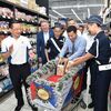 Donates food at Boys' Brigades Day FairPrice Xtra Jurong Point 