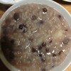 小豆粥をあてに、岩手県盛岡市の菊の司酒造の純米酒七福神を飲む。