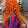 パンチの効いた個性派ヘアデザイン【ビビッドオレンジのスパイラルパーマ】