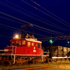 日没の頃の弘南鉄道のED221とホキ800